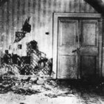 Black-and-white photograph of the room in the Ipatiev House in Ekaterinburg, Russia, where Czar Nicholas II and his family were executed.